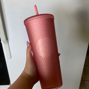 Pink studded Starbucks cup